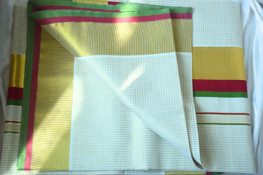 Colorful Kerala Kasavu saree with pink, green, and yellow stripes for Onam 2026