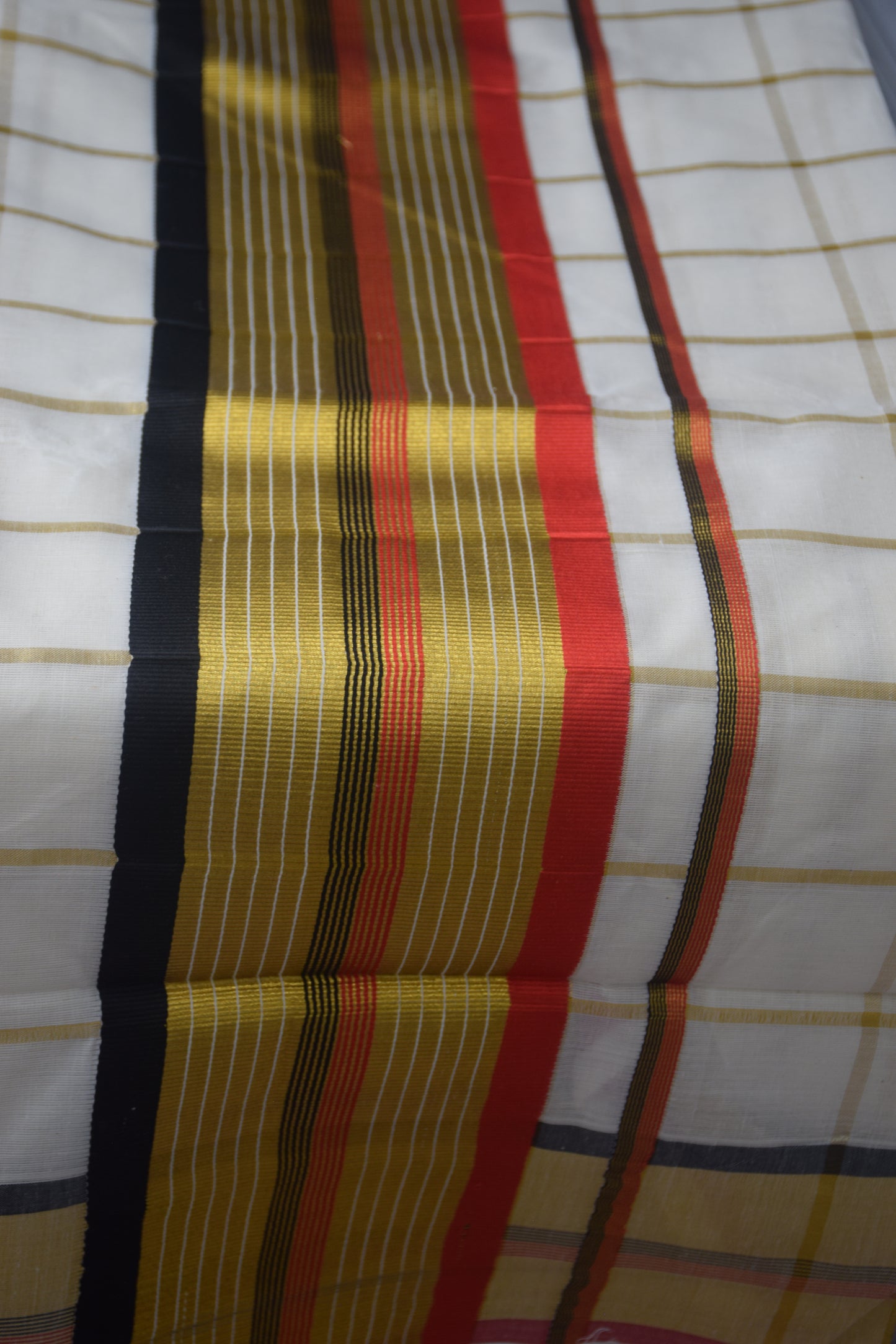 Kerala saree red black checked pattern
