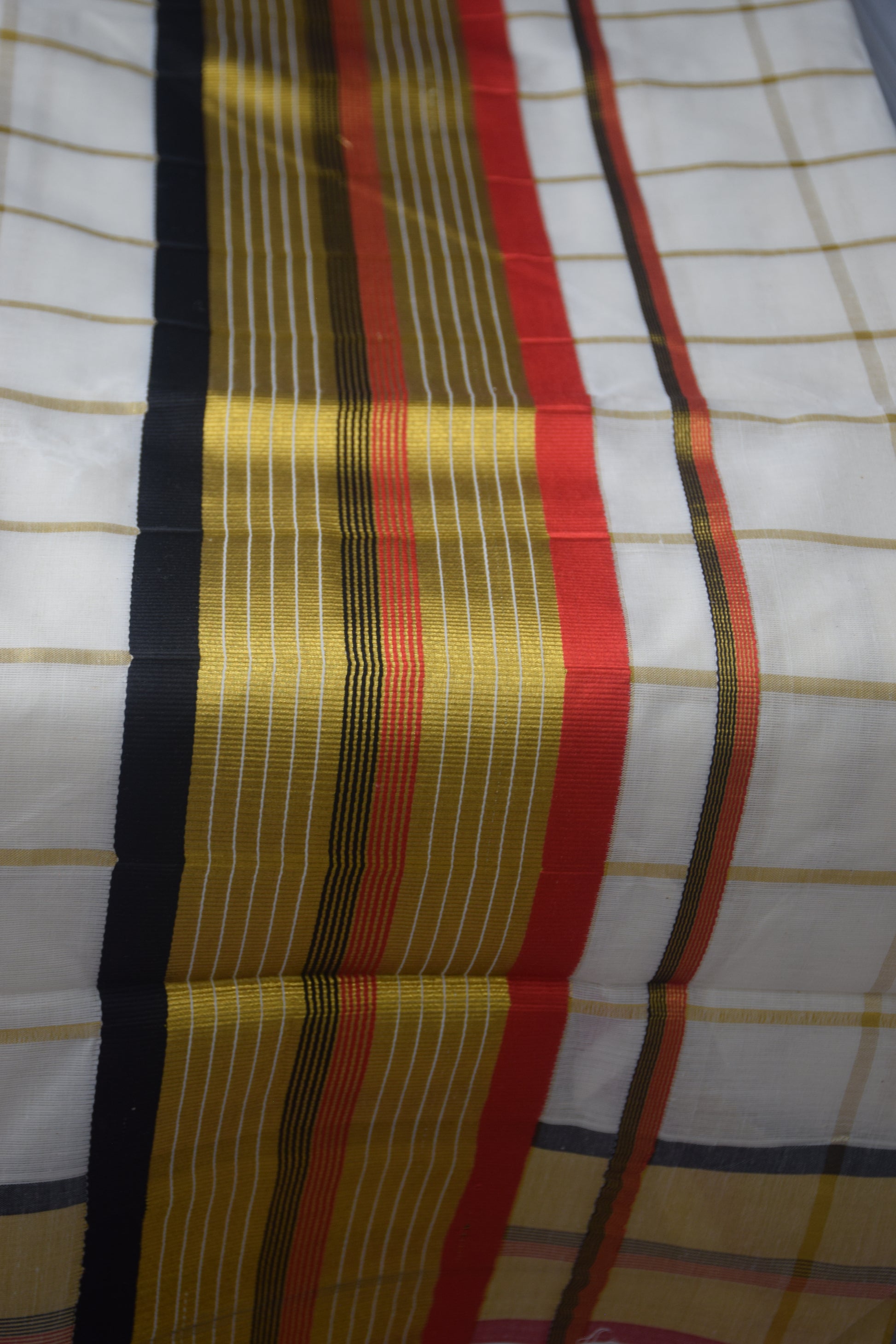Kerala saree red black checked pattern