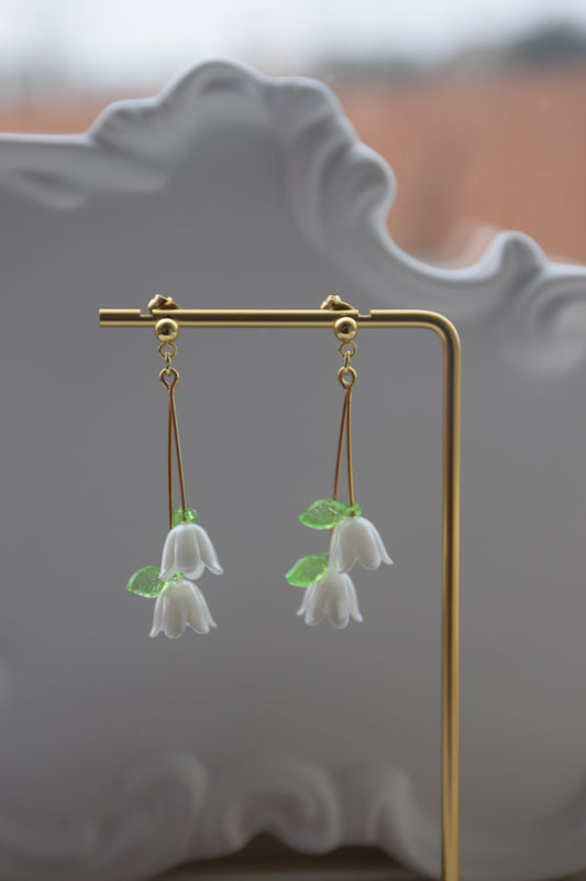 White dangle earring