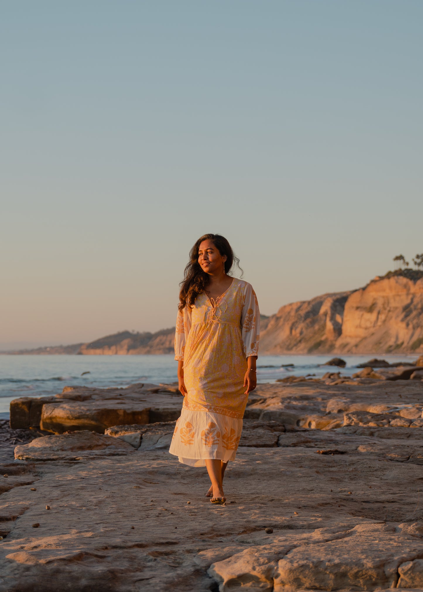 Yellow hand block printed cotton dress with sheer sleeves and floral pattern, sustainable boho vacation wear by Moksha Looms