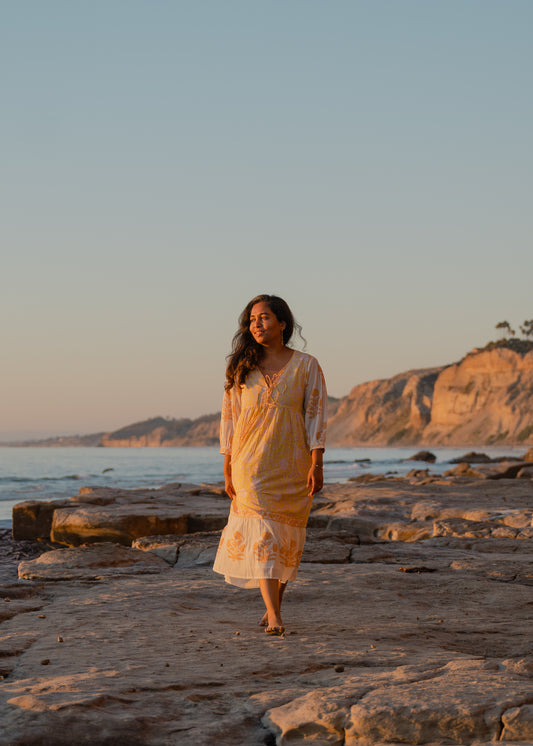 Yellow hand block printed cotton dress with sheer sleeves and floral pattern, sustainable boho vacation wear by Moksha Looms