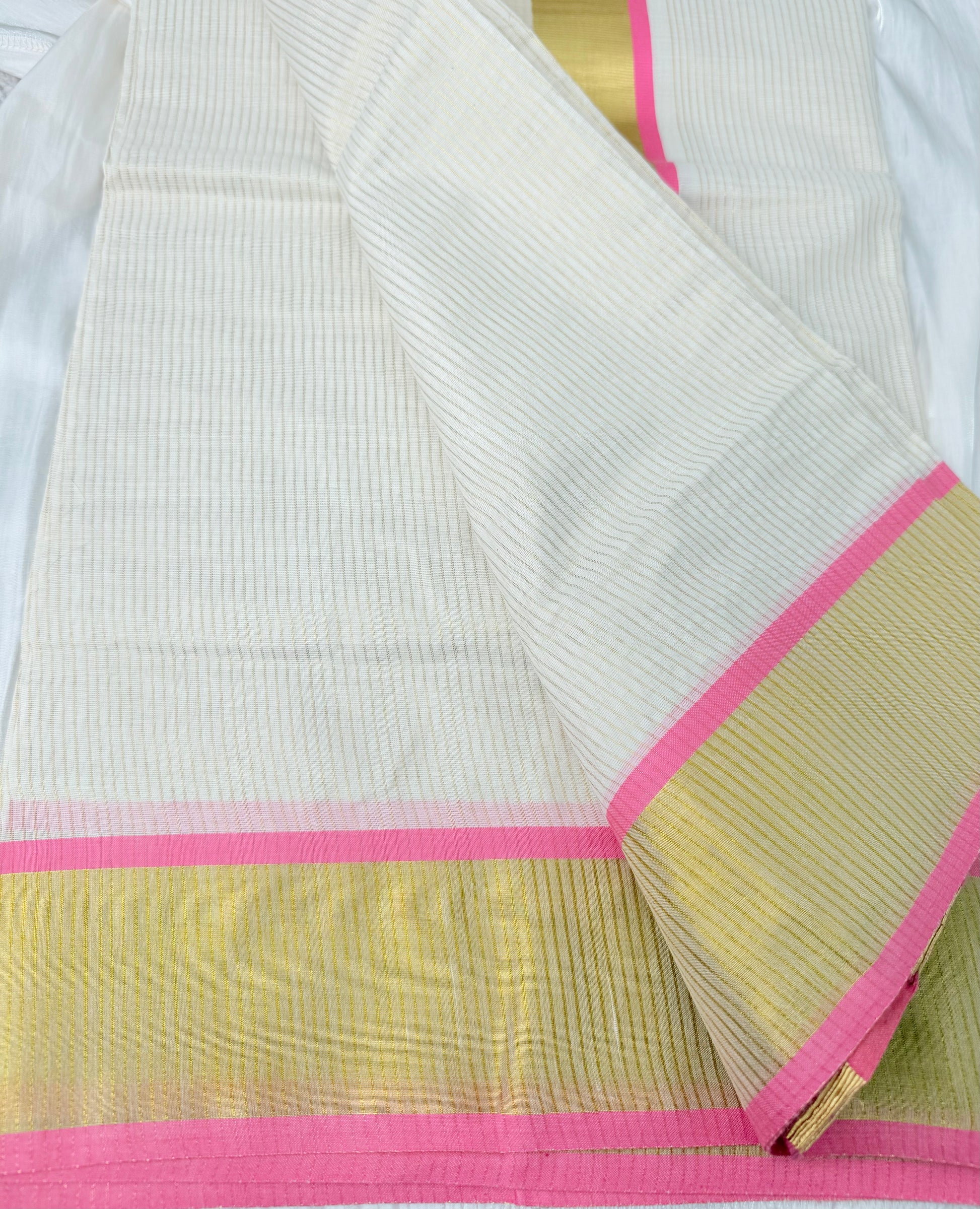 Traditional Kerala saree with pink border


