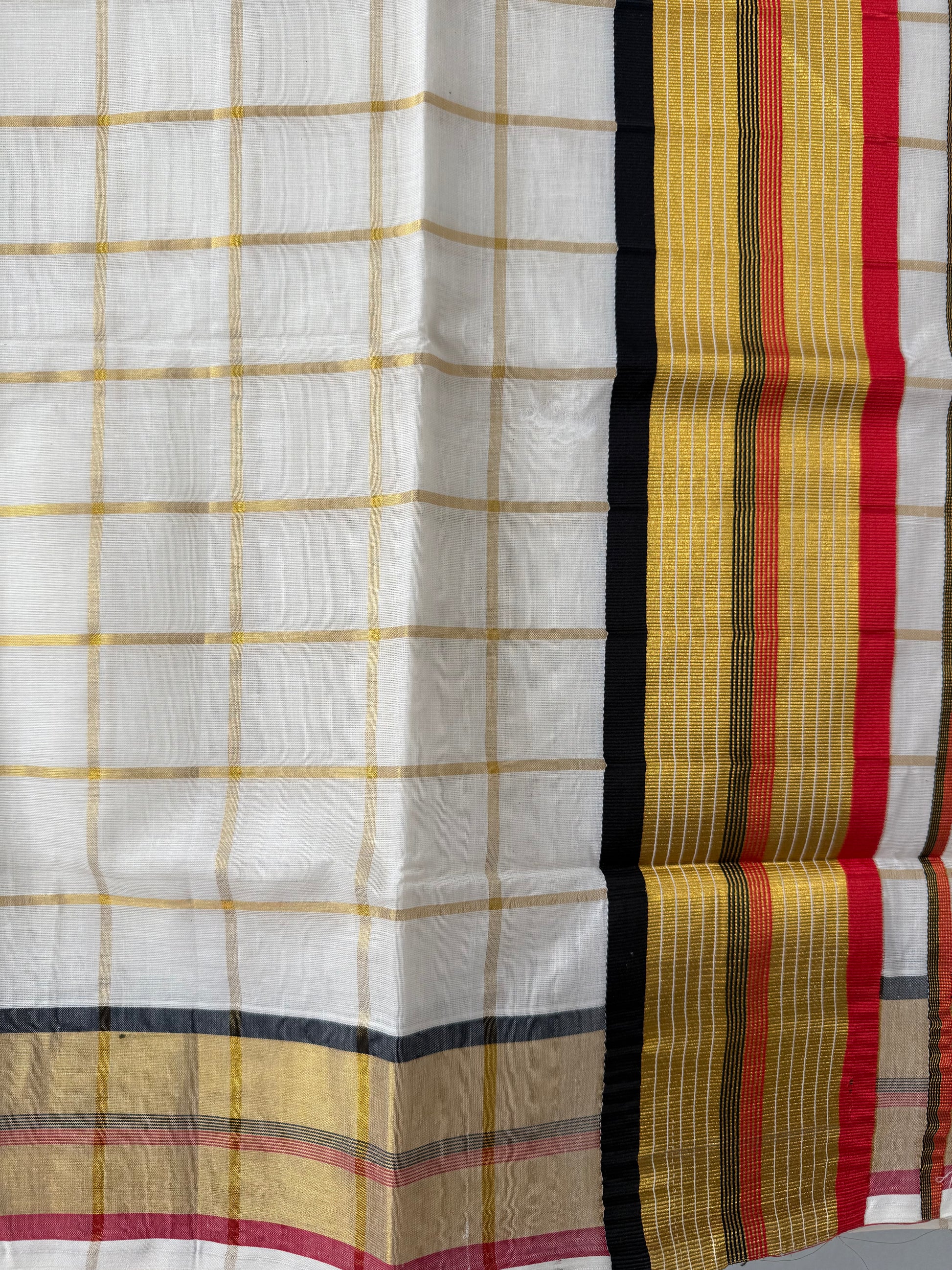 Kerala saree red black checked pattern