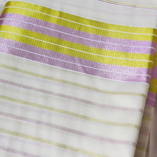 This Kerala saree features elegant pink and green stripes, blending traditional craftsmanship with vibrant colors. 